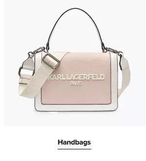 Shop handbags. A pink and white purse.