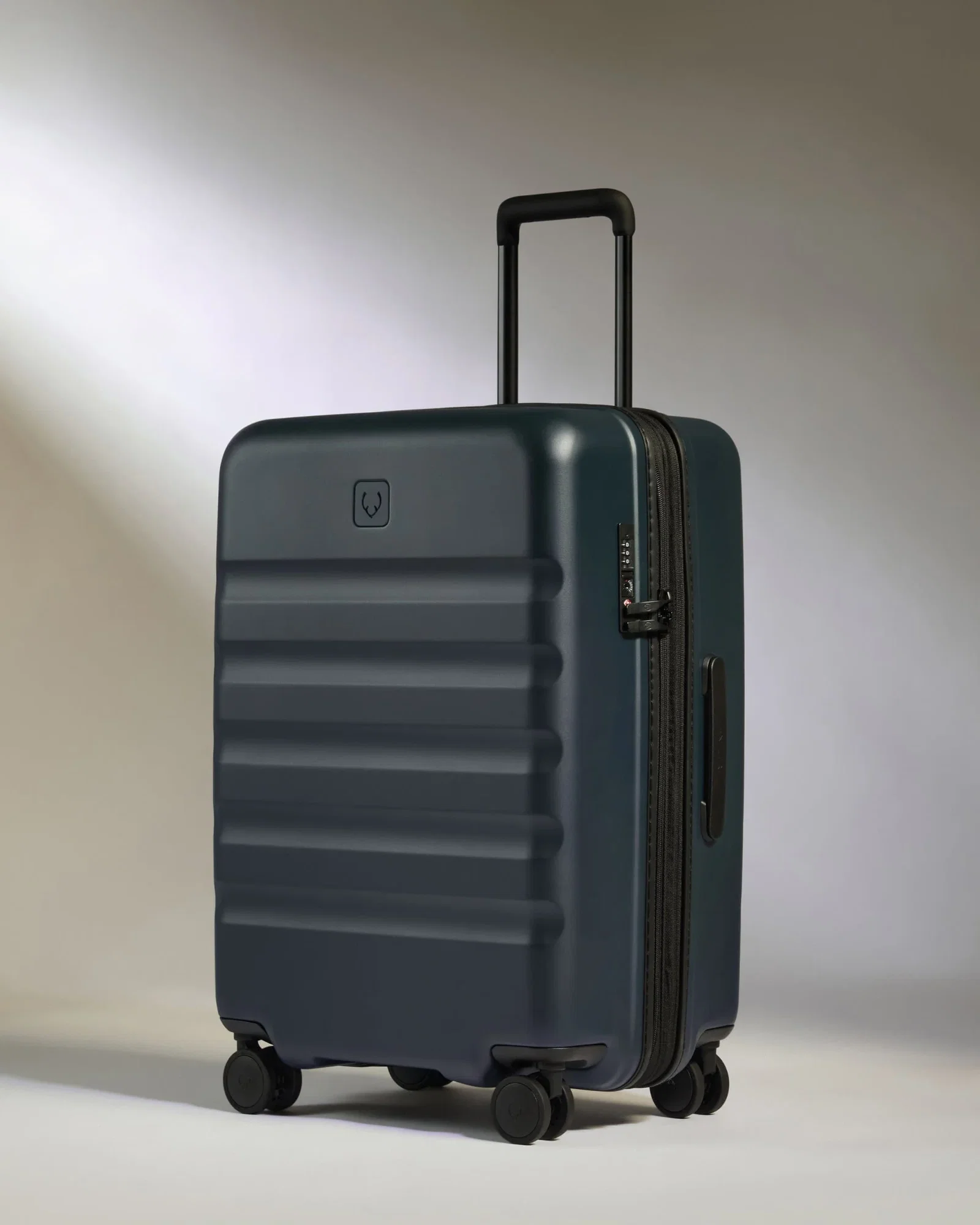 Image of Medium Suitcase in Indigo Blue - Icon Stripe