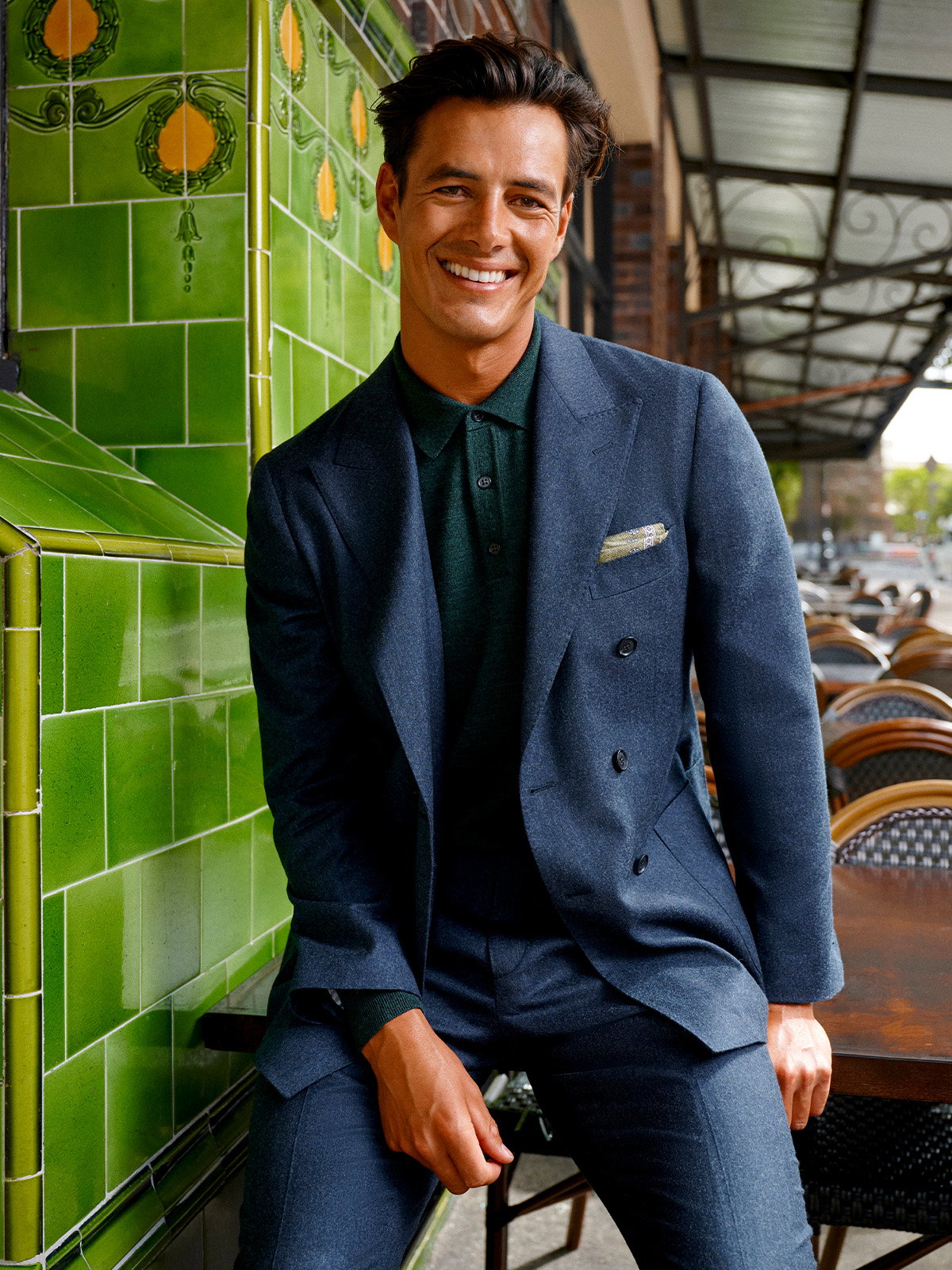 MJ Bale navy flannel double-breasted suit, worn with a dark green shirt and pocket square