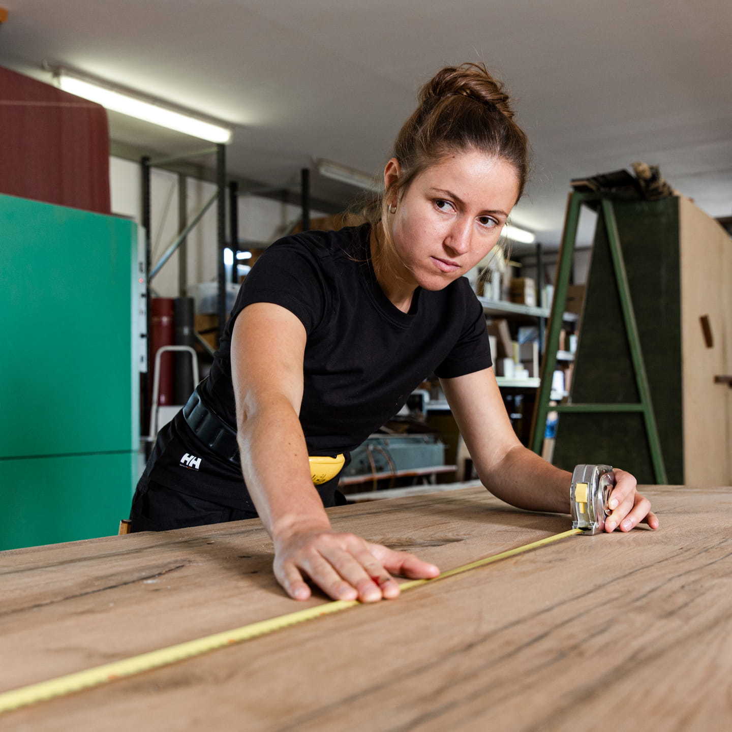 Woman wearing Helly Hansen polo at work