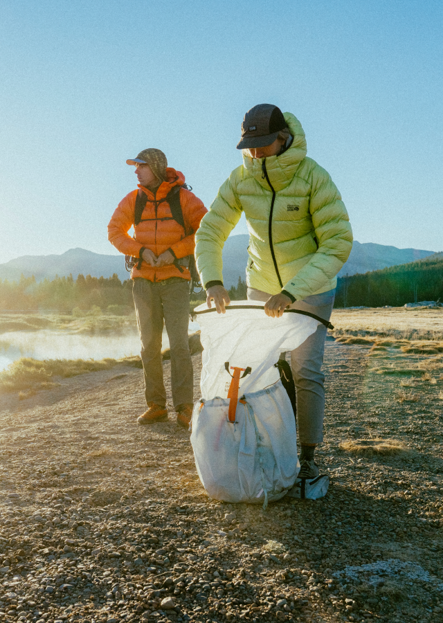 Two hikers in their Phantom™ Alpine Hooded Down Jackets.