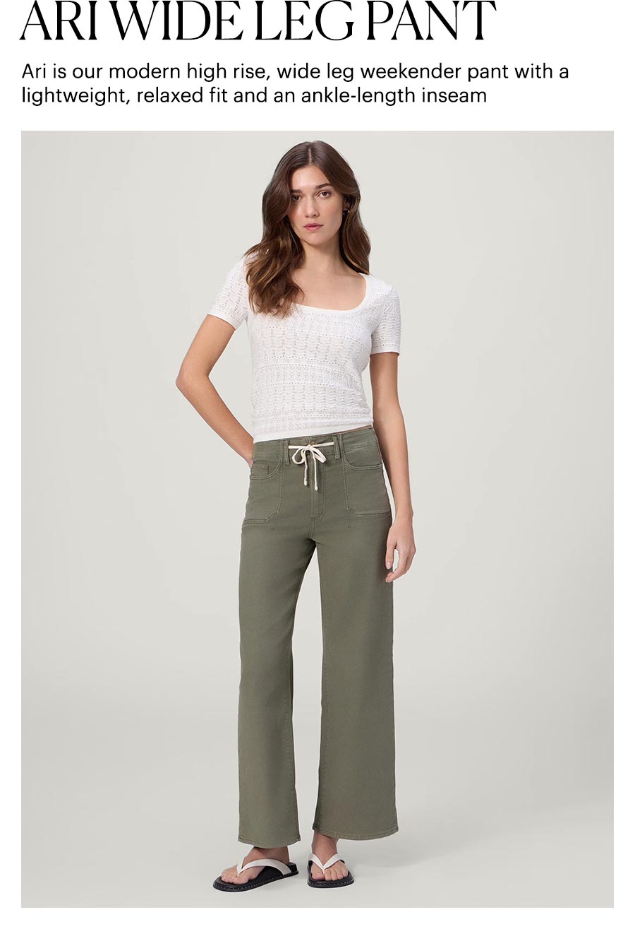 Ari Wide Leg Pant - Ari is our modern high rise, wide leg weekender pant with a lightweight, relaxed fit and an ankle-length inseam. Featuring a woman wearing a pair of muted green high rise wide leg pants with a white embroidered short-sleeve top and white leather flip-flop sandals.