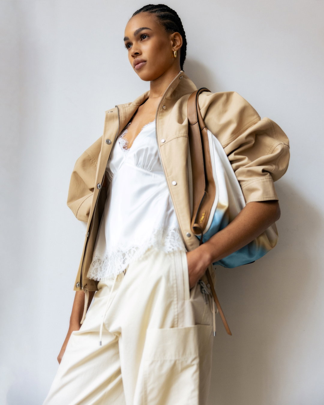 an image of a woman in a white dress holding a purse