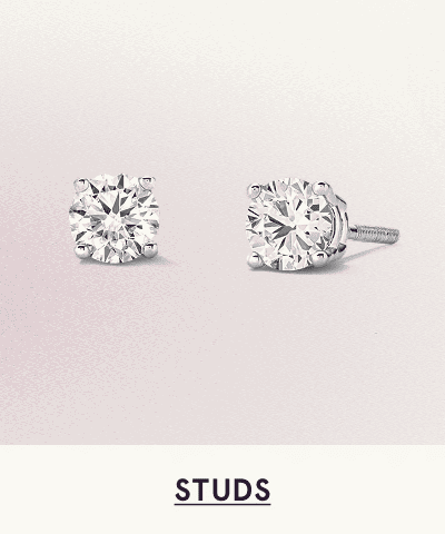 A pair of white metal diamond studs. Click here to shop studs
