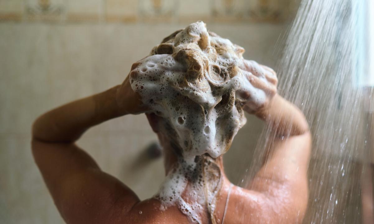 Woman washing her hair. 
