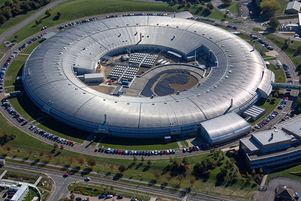 An aerial view of the donut shaped Diamond Light Source building in Oxfordshire.