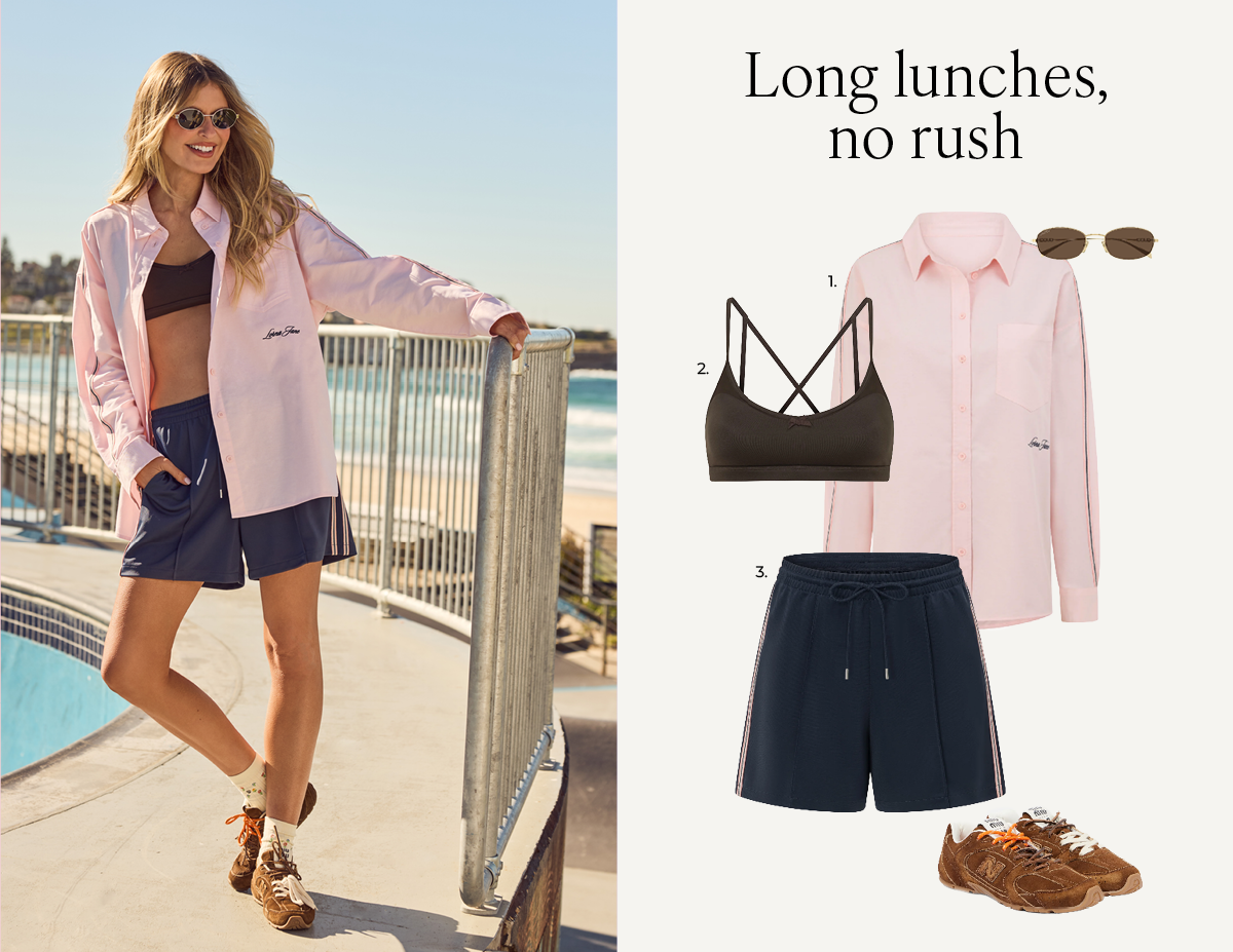Elle wearing the Daydream Long Sleeve Shirt, Rise And Shine All Day Sports Bra, and Retro Shine Longline Shorts by the pool.