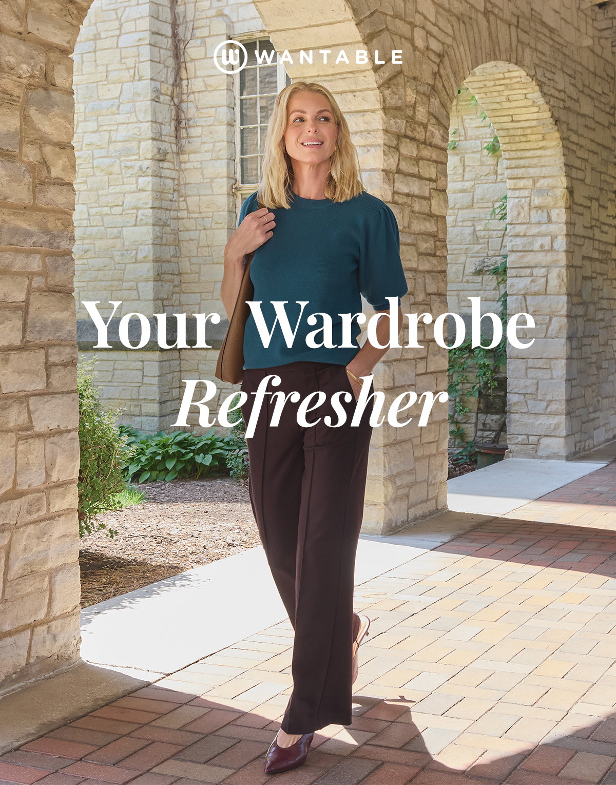 Woman in teal top and brown trousers walks beneath stone arches for back to school.