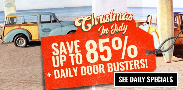 Christmas in July sale featuring a vintage station wagon on the beach with a sign advertising Save Up to 85% plus Daily Door Busters and a See Daily Specials button.