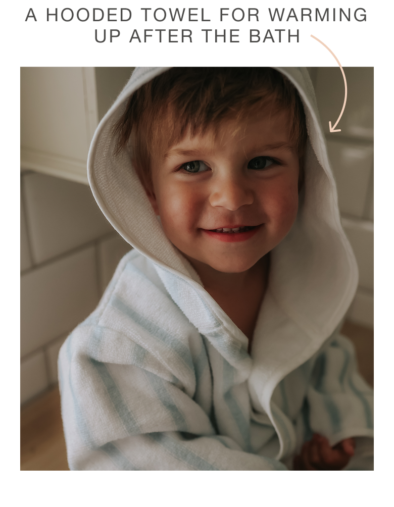 boy in hooded towel bath robe