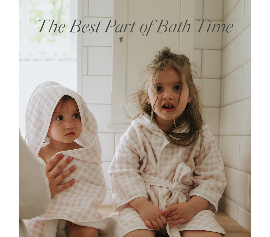 two kids sitting in bath robes
