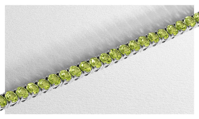 White gold green peridot gemstone tennis bracelet.
