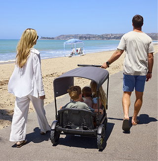 Family walking with Veer beach Cruiser
