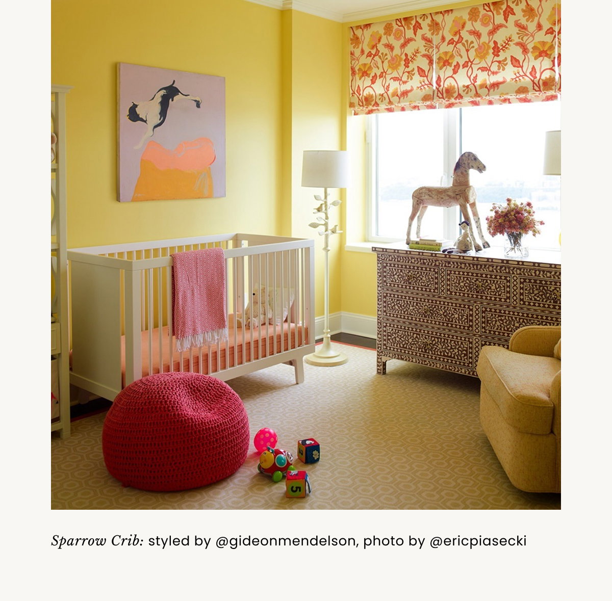 an image of a child's room with a crib and a rainbow