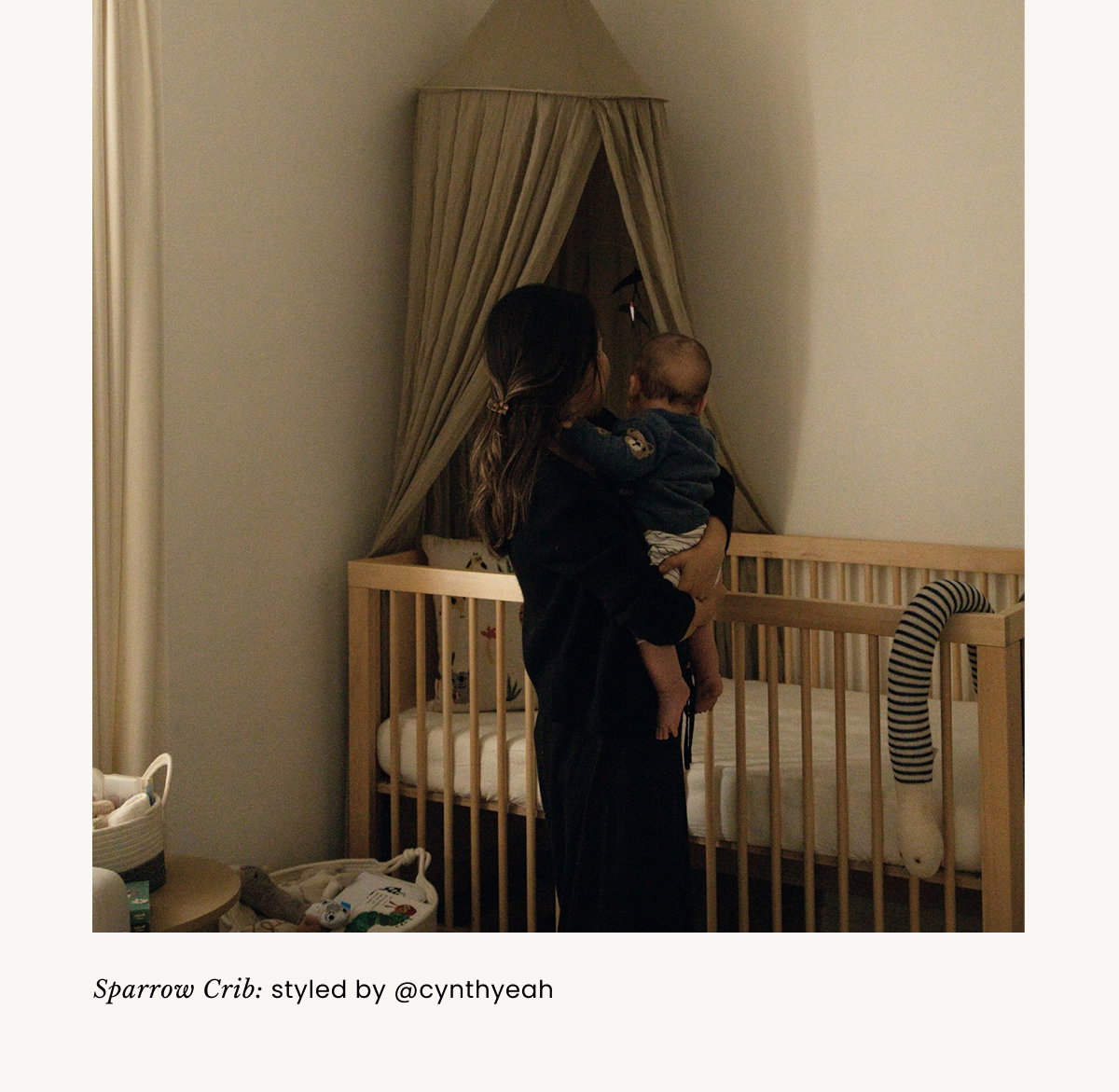 an image of a child's room with a crib and a rainbow