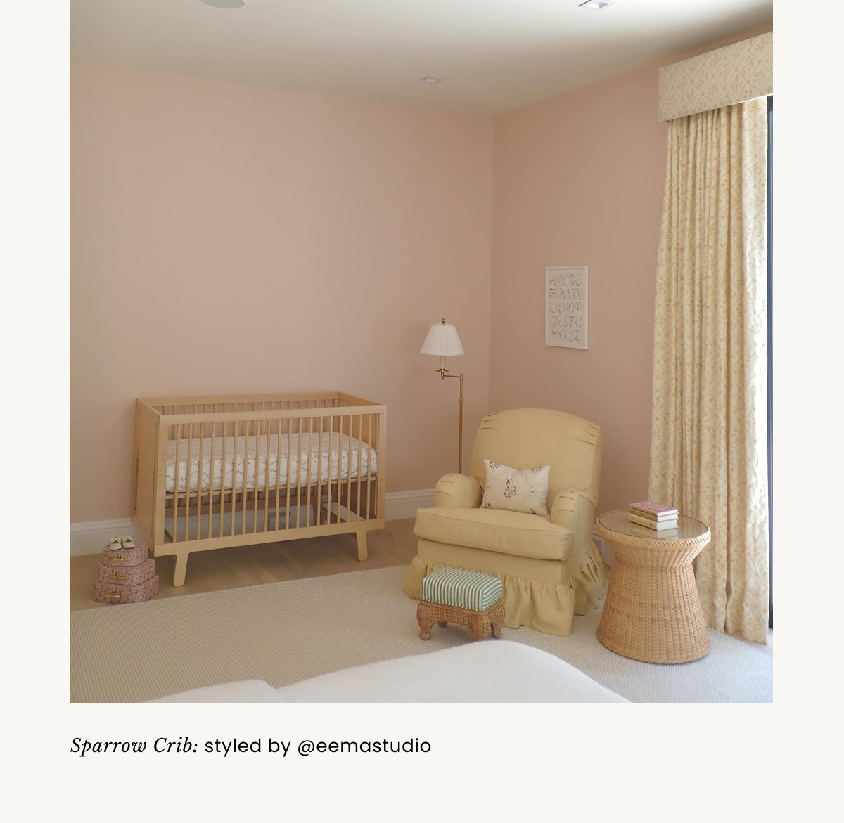 an image of a child's room with a crib and a rainbow