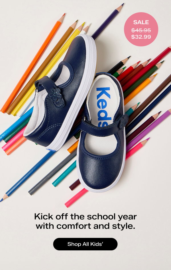 A grey background with an array of colored pencils and a pair of the Little Kids' Ella Mary Janes in navy. A pink circle shows the style was $45.95 and is now on sale for $32.99. The text says Kick off the school year with comfort and style. Shop All Kids'