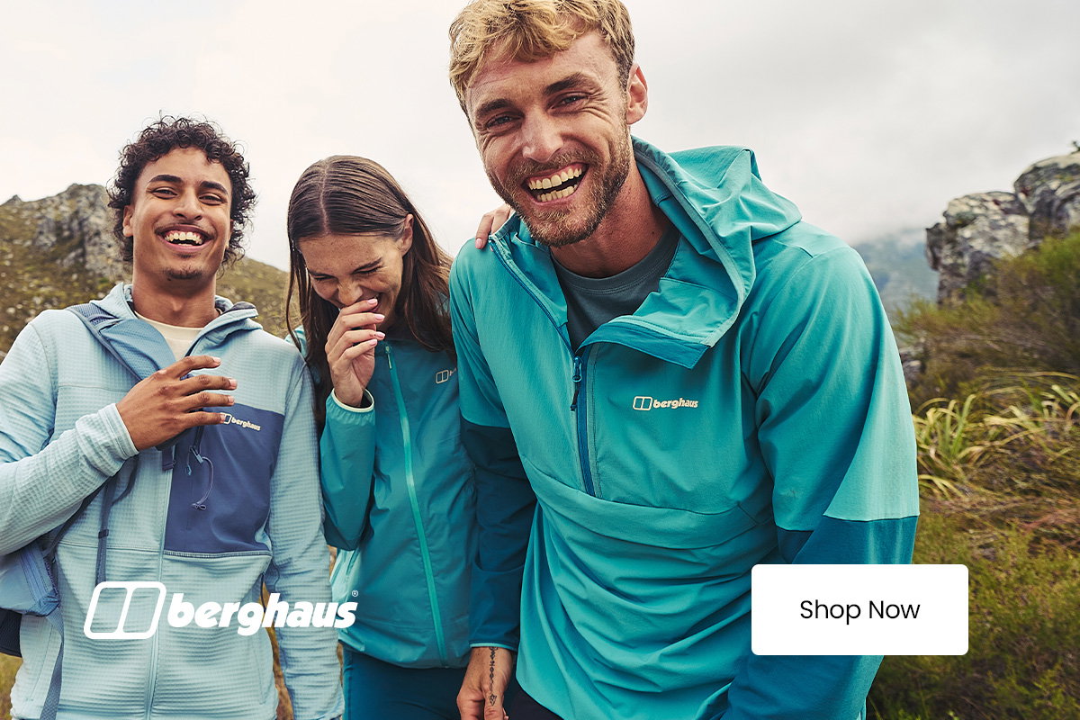 Three people wearing Berghaus outdoor jackets stand on a rocky hillside, with the Berghaus logo and a “Shop Now” call-to-action displayed in the image.