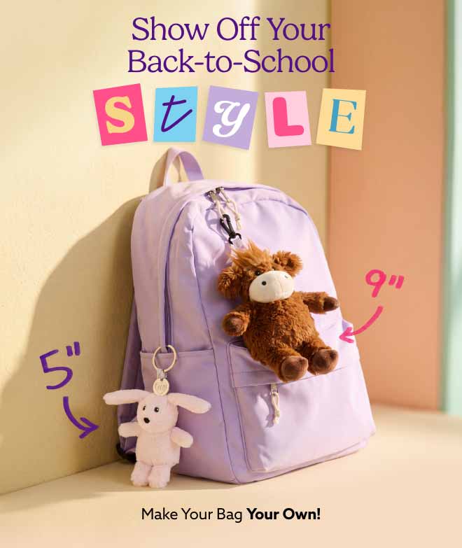 Bag Charm Warmies clipped onto a backpack. Shop Now.