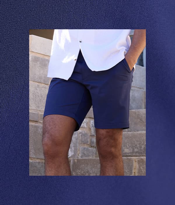 Man poses in a Haggar Sport shorts, text says, "Built for Motion" and button says, "Shop Haggar Sport"