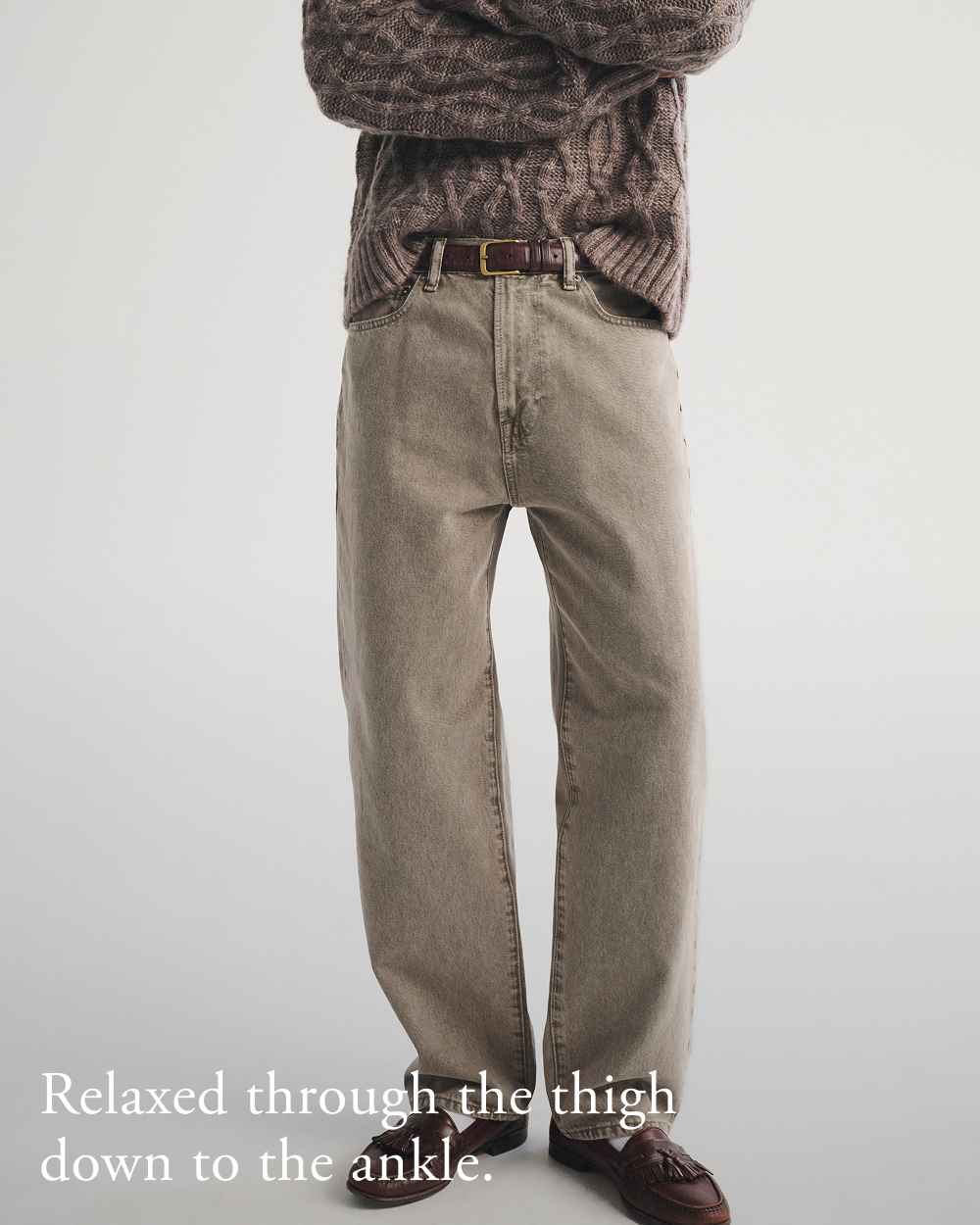 Relaxed through the thigh down to the ankle.