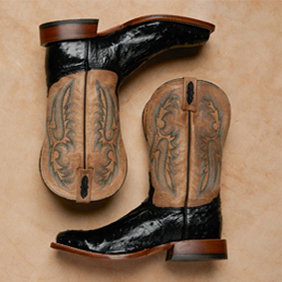 Image of Tony Lama boots on a leather background.