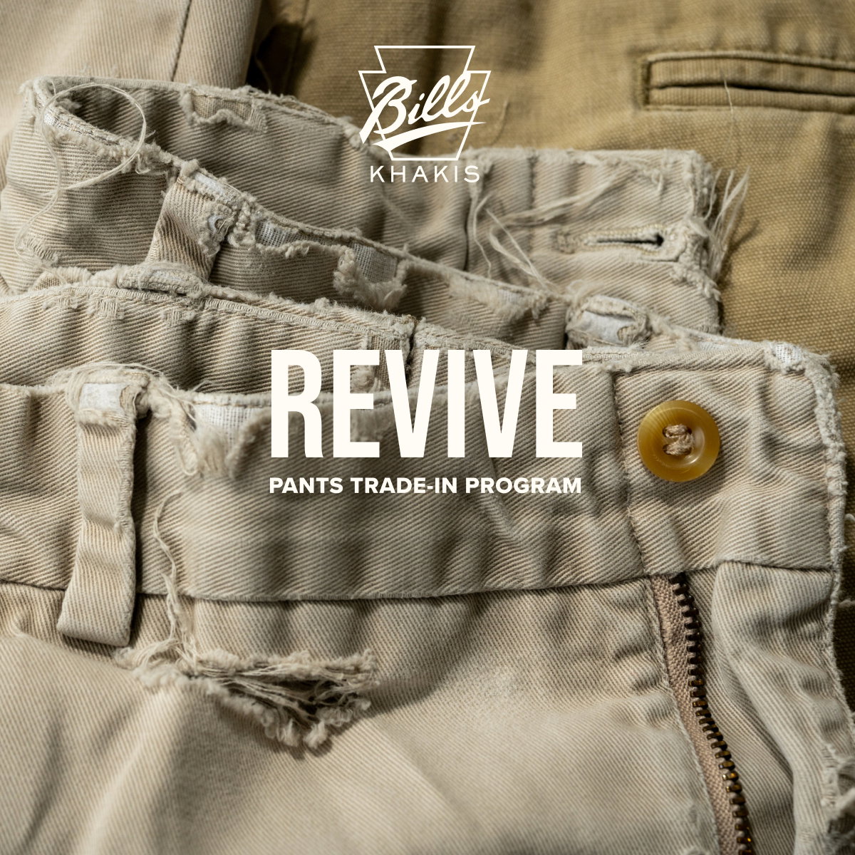 A close up shot of a pair of Bills Khakis showing tears and age. The Bills Khakis logo sits with a text overlay reads: REVIVE | Pants trade-in program 