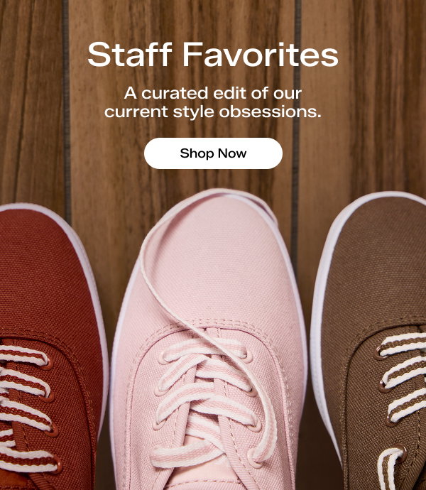 A wood panel background with an overhead view of the Keds Champion Canvas Lace-Ups in rust, petal pink, and cocoa brown. The email says Staff Favorites. A curated edit of our current style obsessions. Shop Now.