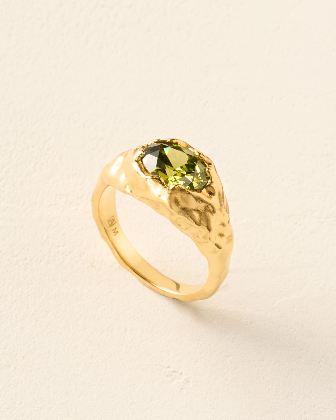Maria ring: textured gold ring set with an olive-green oval stone