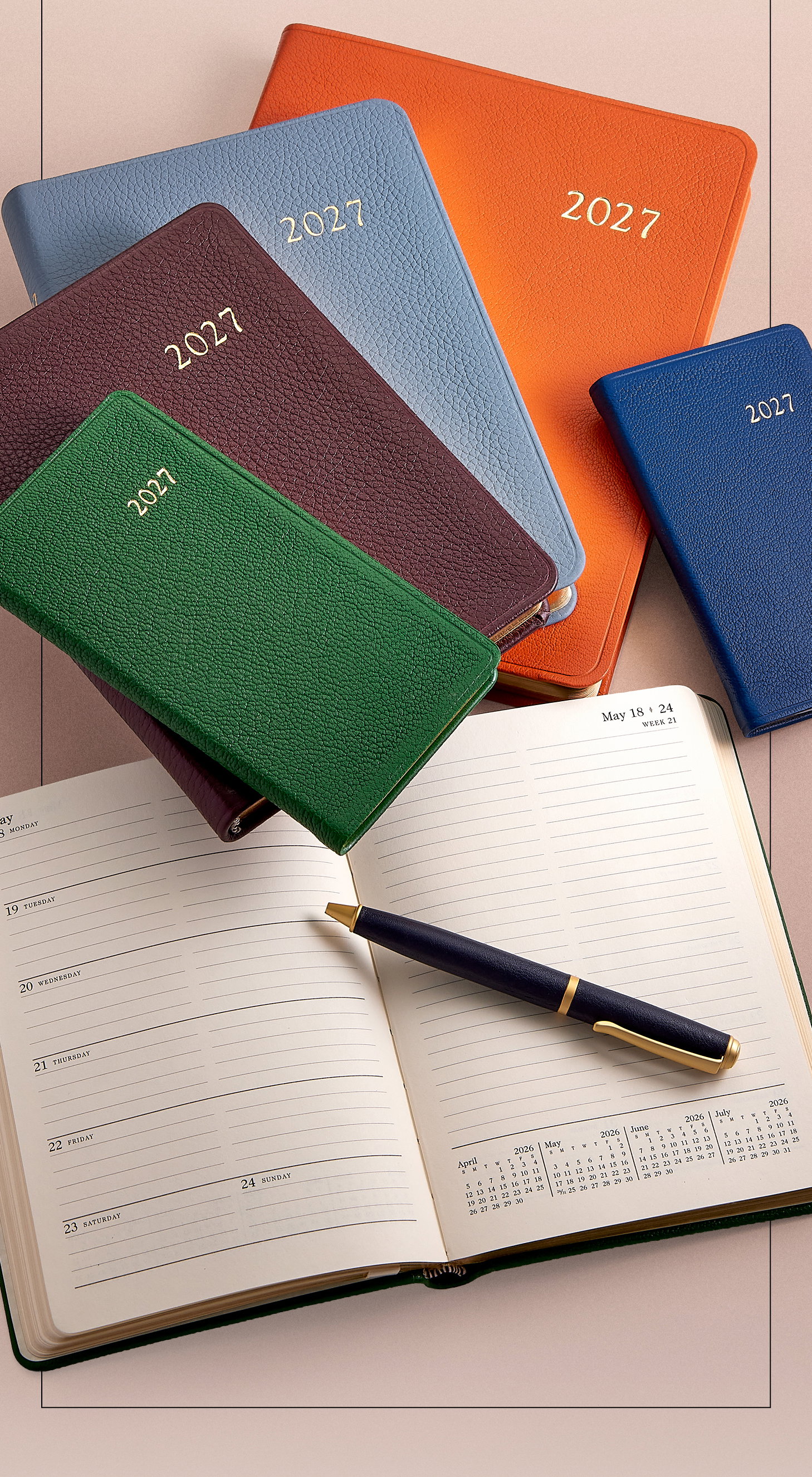 2027 datebooks in Orange, Royal Blue, Slate Blue, Wine, and Green leather.