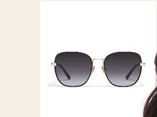 Image of large gold sunglasses with navy lenses