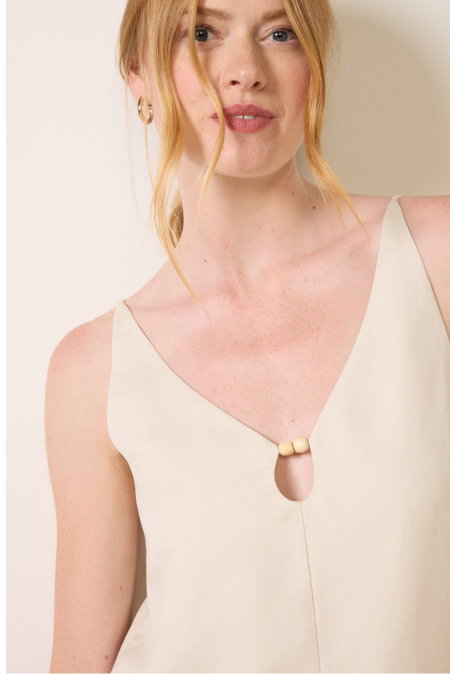 Image of model in cream and wood beaded tank top from EVEREVE.