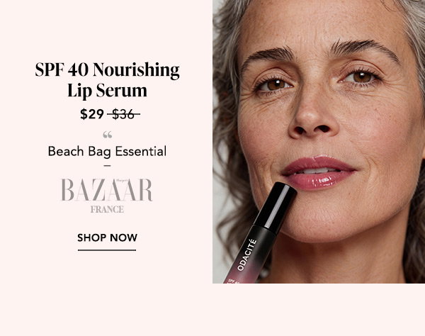 SPF 40 Nourishing Lip Serum: Woman applying SPF 40 Nourishing Lip Serum; named a Beach Bag Essential by Harper’s Bazaar France, now $29.