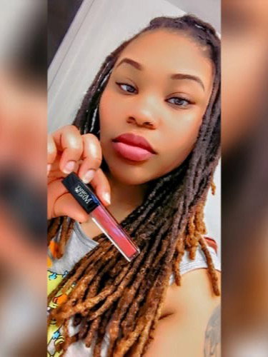 Kamania M. wearing Stay Put Matte Lip Cream