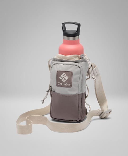 A pink water bottle in a tan and mauve water bottle bag.
