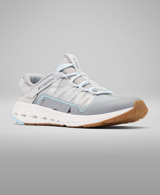 A white and grey sneaker with light blue accents. 