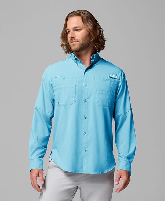 A man wearing a blue button up shirt.