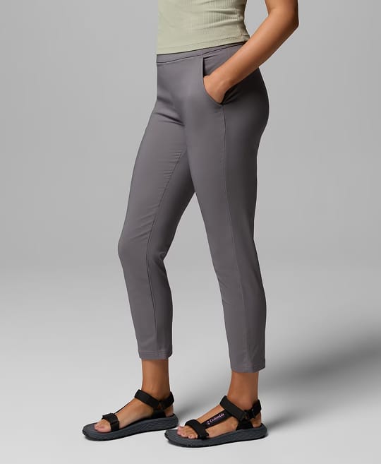 Waist-down image of a woman wearing grey pants.