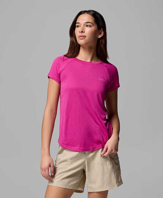 A woman wearing a pink shirt.