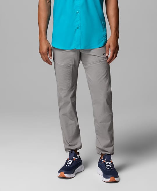 Waist-down image of a man wearing grey pants.