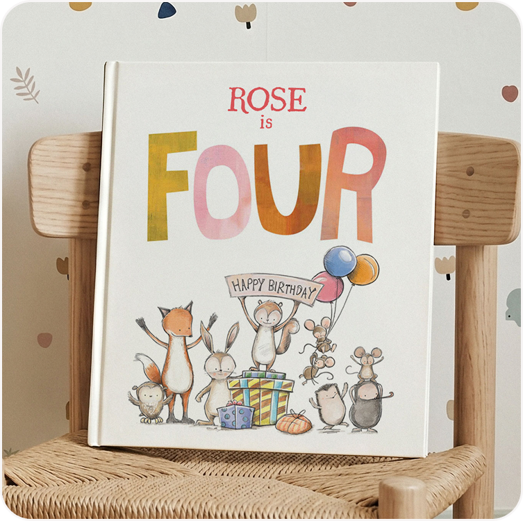 A personalised birthday story book with the name Rose on the cover, showing woodland animals celebrating with balloons and gifts