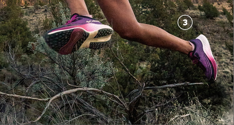 A woman runner leaping.