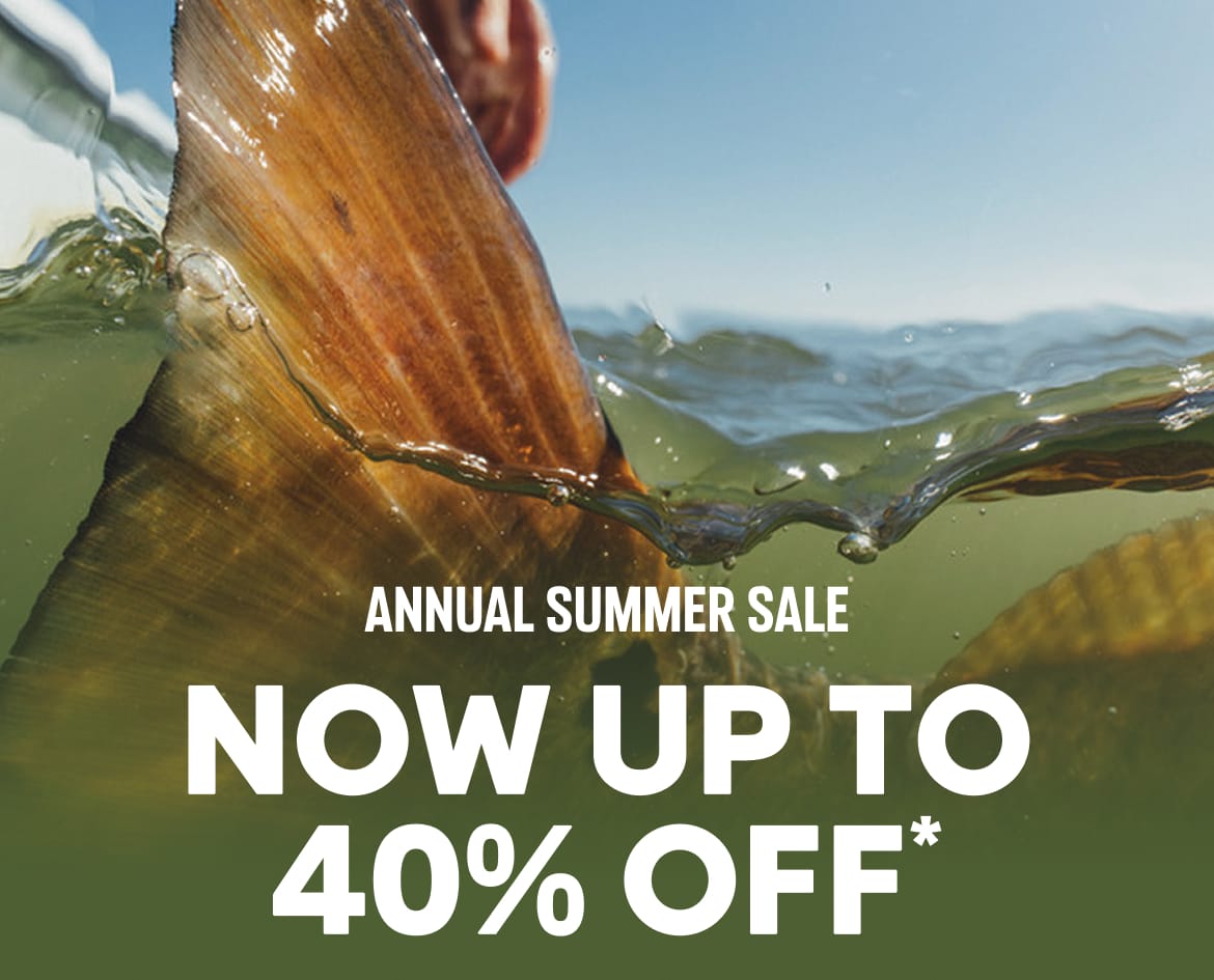 Close-up of a fish tail in the water with text: ANNUAL SUMMER SALE NOW UP TO 40% OFF*