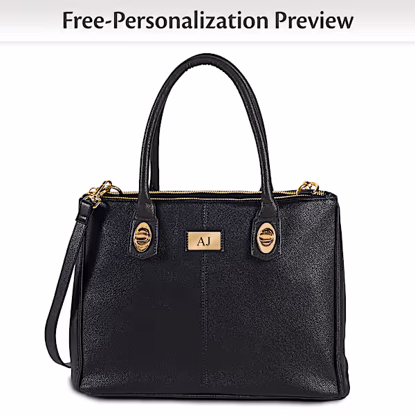 Black faux leather tote bag features four handles in black, brown, ivory and red