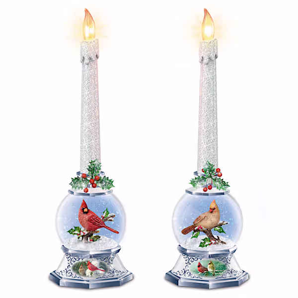 Set of 2 flameless tapered candles rise from illuminated glass snowglobes with sculptural cardinals