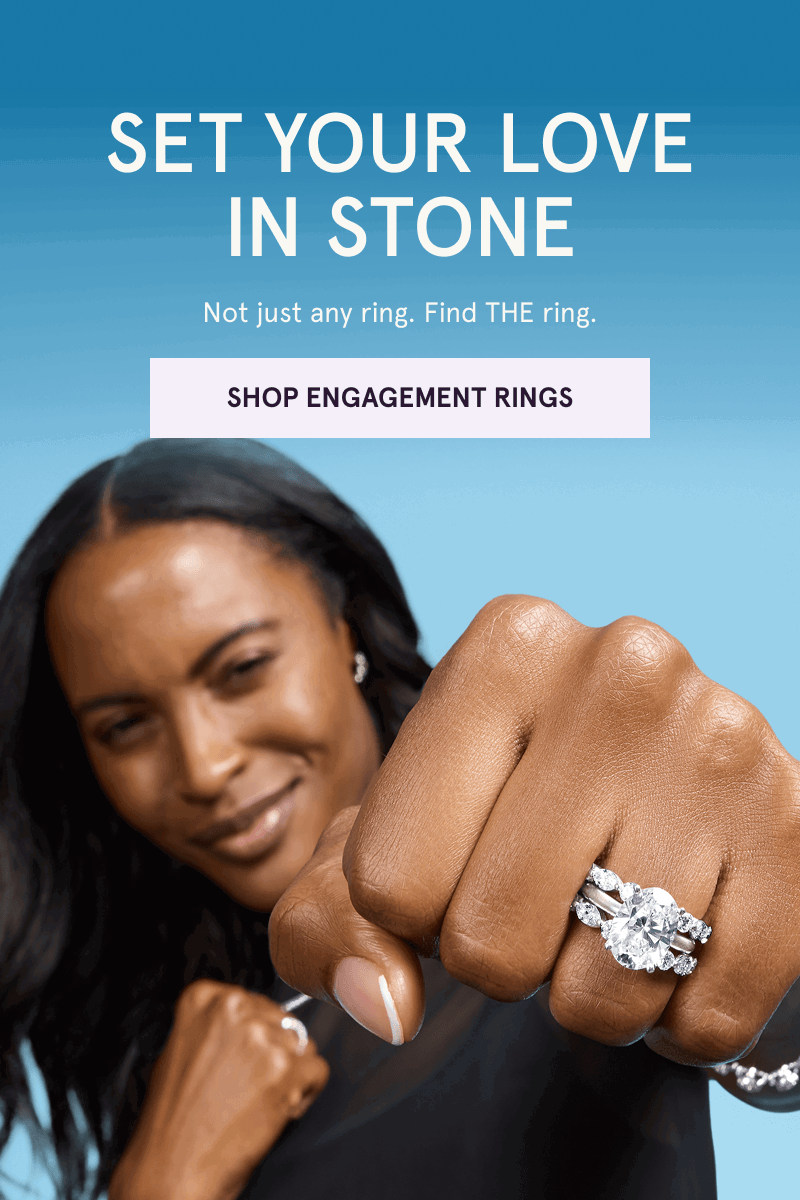 Focus on model’s oval-shaped diamond ring & eternity bands. Find THE ring. Click here to shop engagement rings