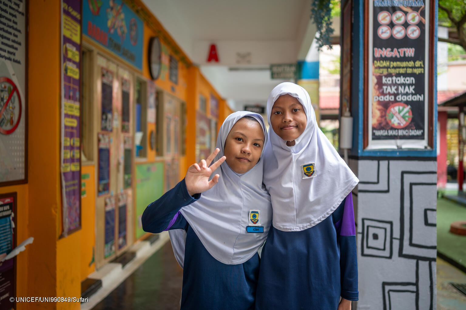 Azinah understands me. We made our own signs, says Una, 12, who was born deaf.