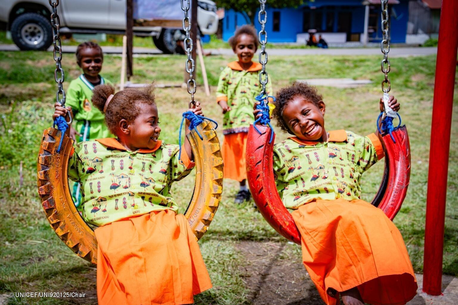 Kerenzia, 3, and friends play together outdoors at an early childhood education centre In West Papau.