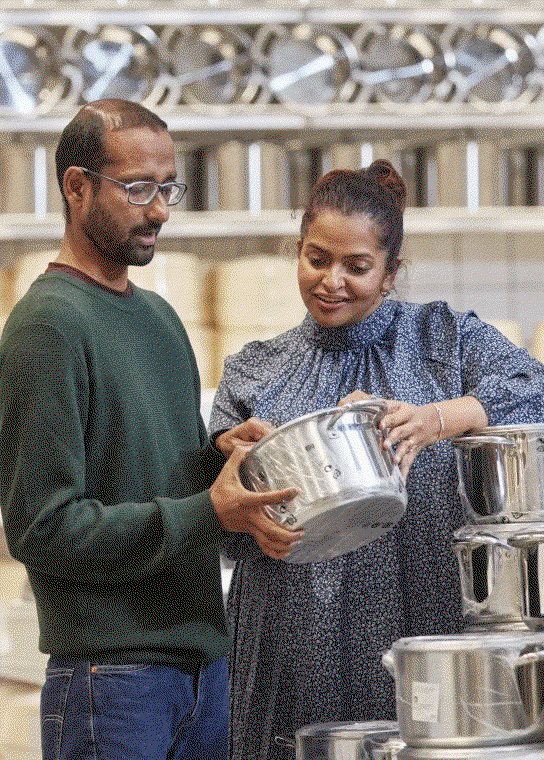 Two people looking at cookware 