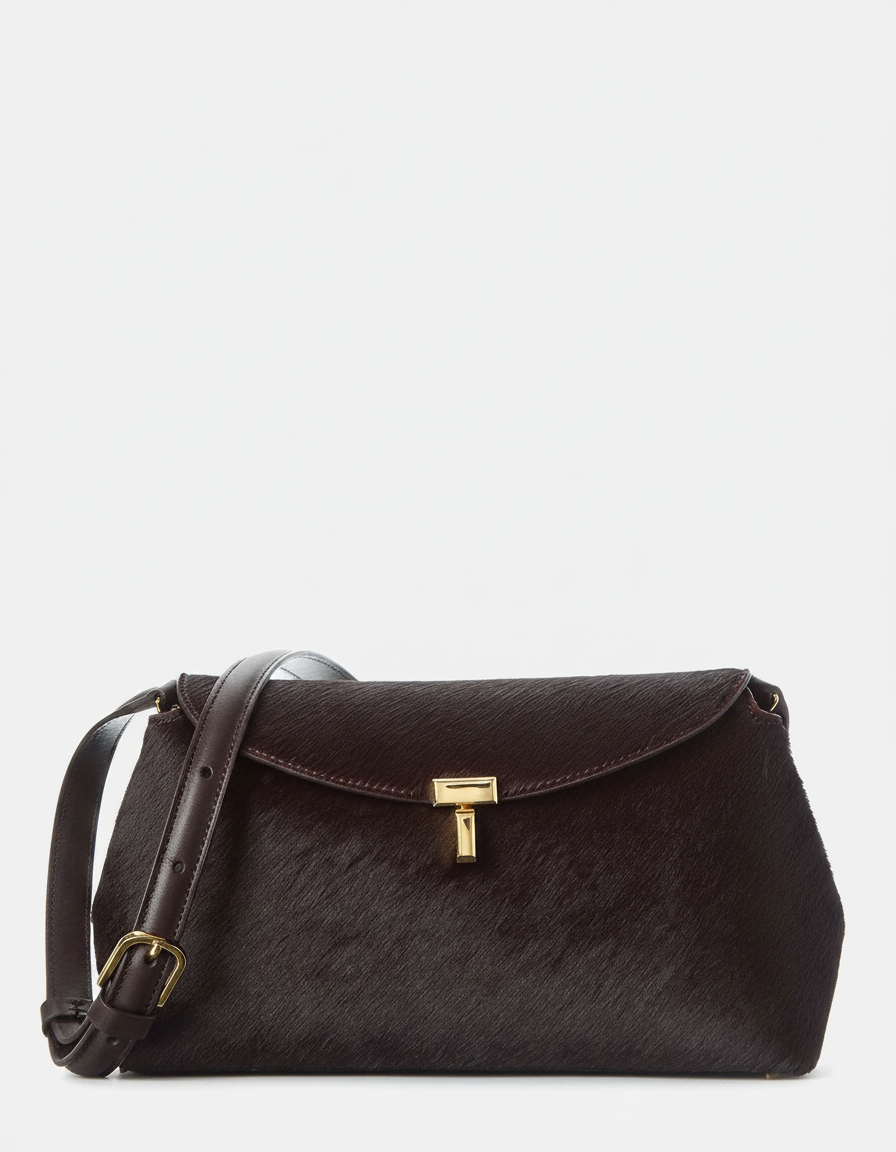 A dark brown, textured crossbody bag with a gold clasp and buckle.